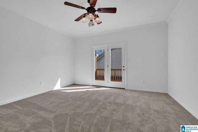 carpeted spare room featuring crown molding and ceiling fan