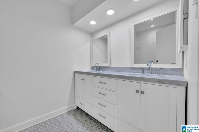 bathroom featuring vanity and a shower