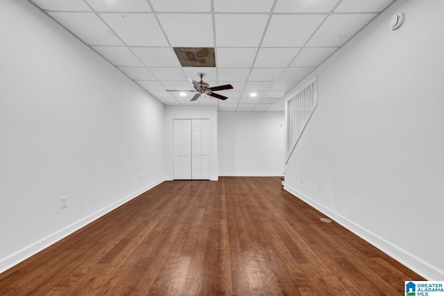 basement featuring hardwood / wood-style flooring and ceiling fan