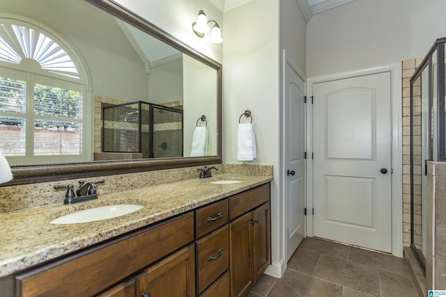 bathroom featuring an enclosed shower, vanity, crown molding, and lofted ceiling