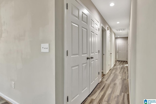 hall with light wood-type flooring