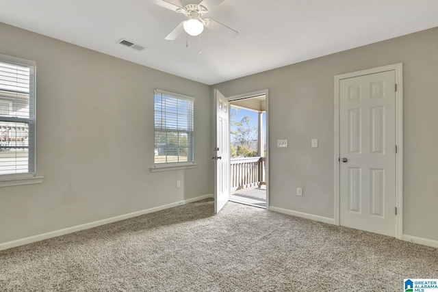 carpeted empty room with ceiling fan