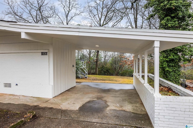 garage featuring a carport