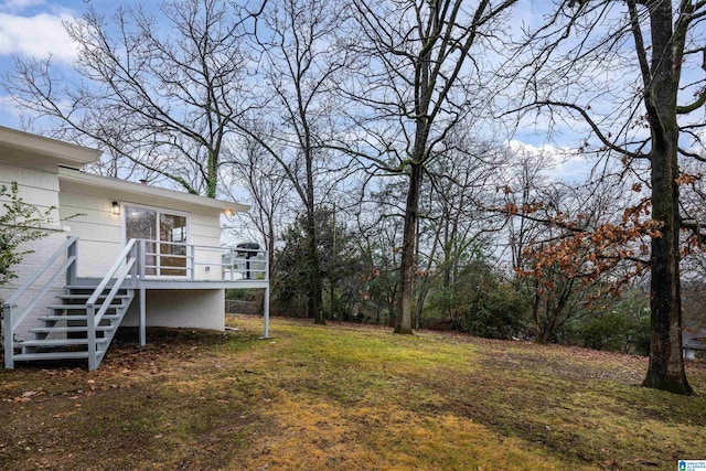 view of yard featuring a wooden deck