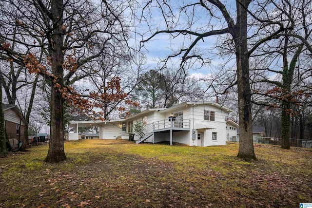 back of property featuring a yard