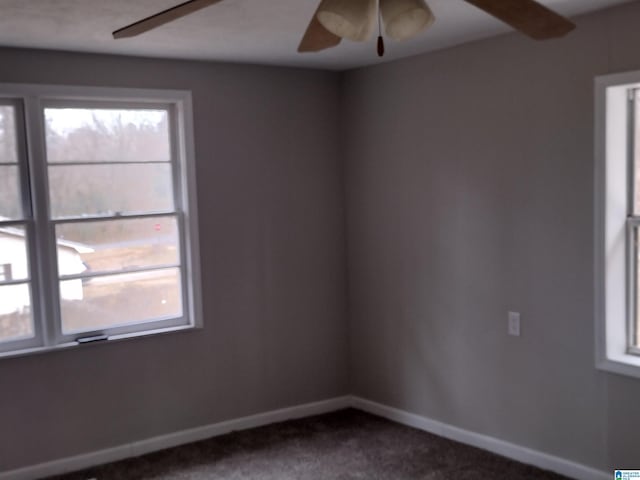 carpeted empty room with ceiling fan