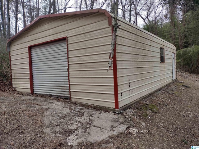 view of outbuilding featuring a garage