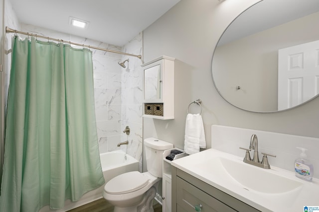 full bathroom with vanity, shower / bath combination with curtain, and toilet