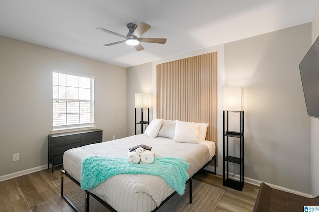 bedroom featuring wood-type flooring and ceiling fan