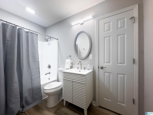 full bathroom featuring vanity, wood-type flooring, toilet, and shower / bath combo