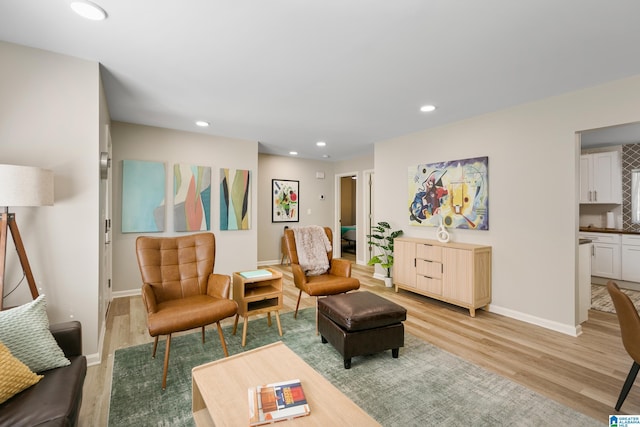 sitting room featuring light hardwood / wood-style floors