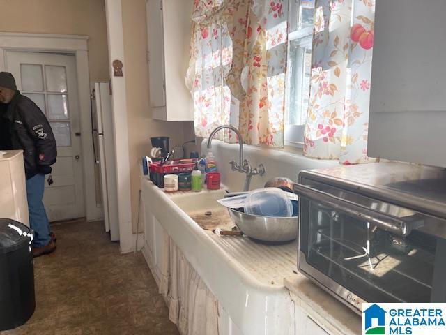 kitchen with white cabinetry