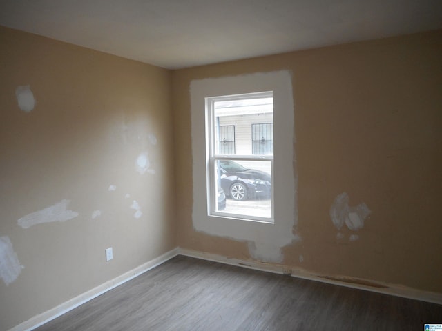 empty room featuring wood-type flooring