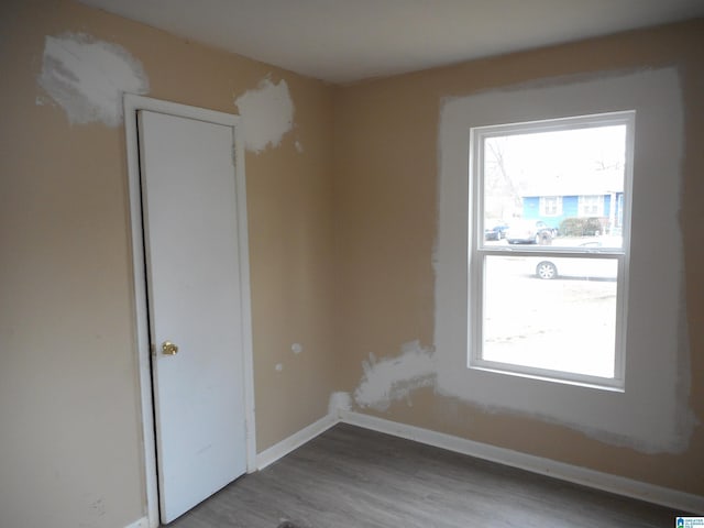 unfurnished room featuring hardwood / wood-style floors