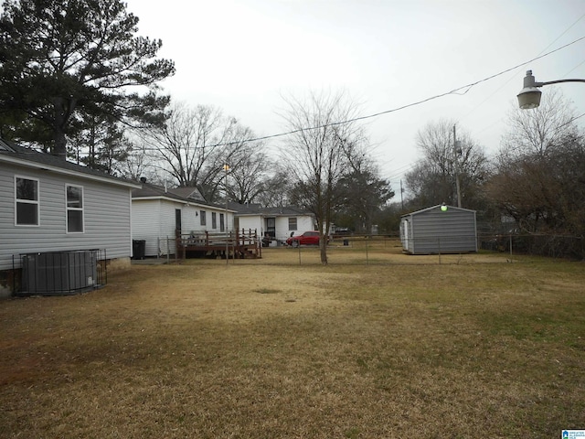 view of yard featuring central air condition unit