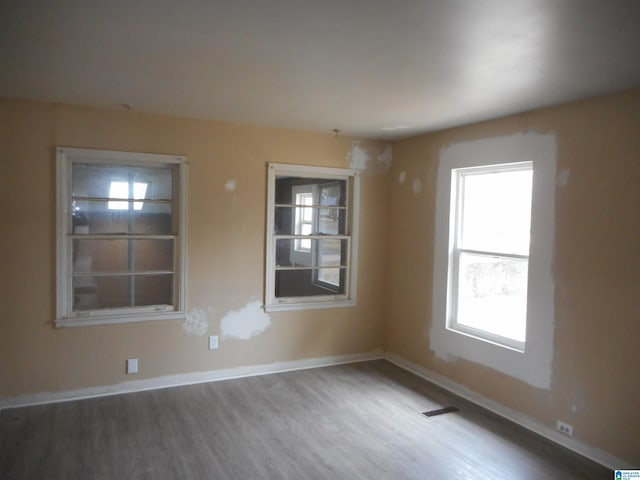 empty room featuring hardwood / wood-style floors