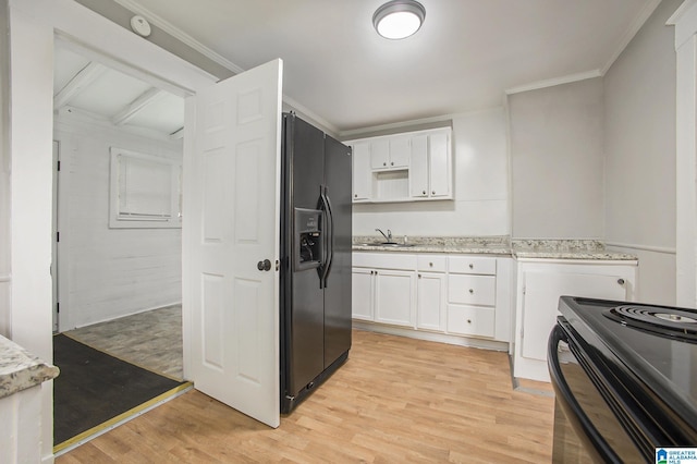 kitchen with sink, white cabinets, ornamental molding, black appliances, and light hardwood / wood-style flooring