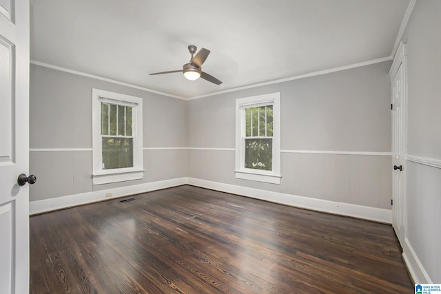 unfurnished room with crown molding, dark hardwood / wood-style floors, and ceiling fan