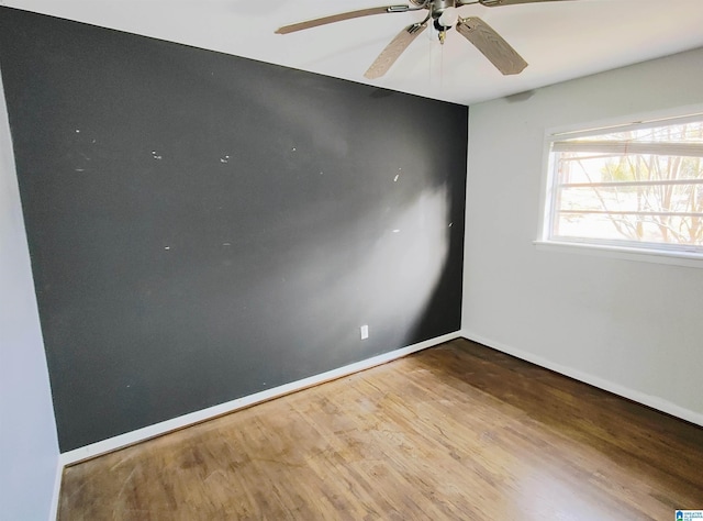 spare room with wood-type flooring