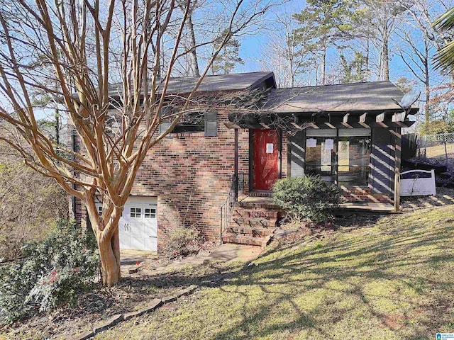 exterior space with a garage and a front yard