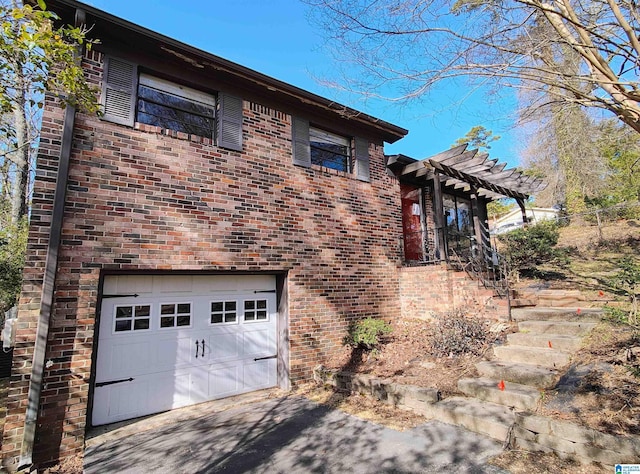 view of side of home with a garage