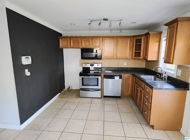 kitchen featuring light tile patterned flooring, appliances with stainless steel finishes, crown molding, and sink