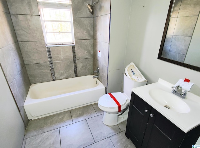 full bathroom with tiled shower / bath, vanity, toilet, and tile patterned flooring