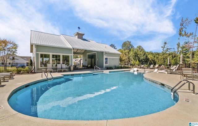 view of swimming pool featuring a patio