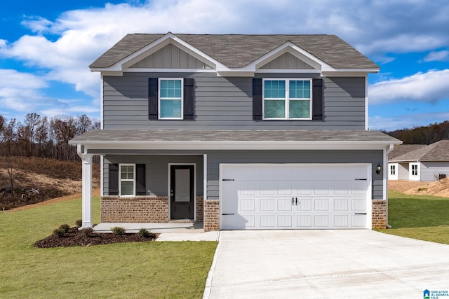 craftsman inspired home featuring a garage and a front lawn