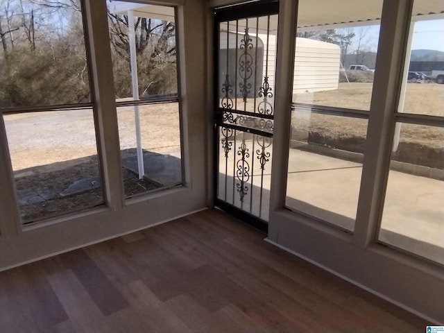 doorway featuring dark hardwood / wood-style floors