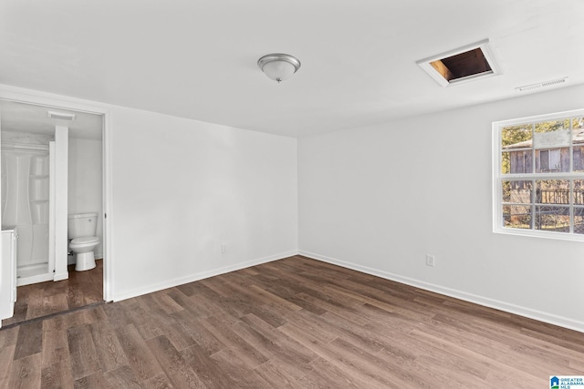 empty room featuring dark wood-type flooring