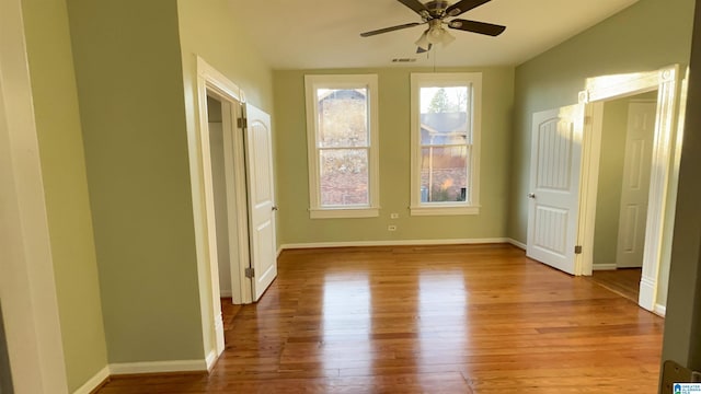 unfurnished bedroom featuring ceiling fan and light wood-type flooring