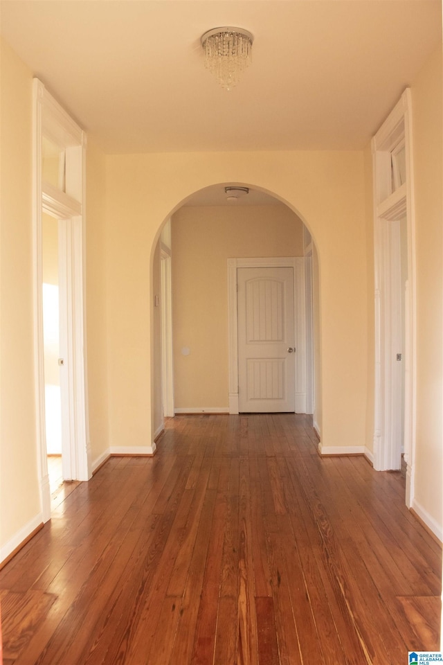 hall with dark wood-type flooring