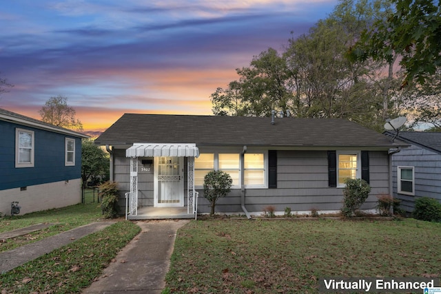 view of front of home featuring a lawn