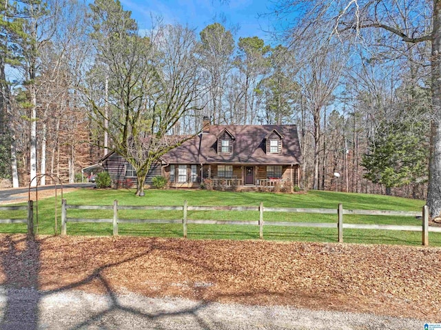 new england style home with a front lawn