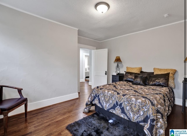 bedroom with ornamental molding, dark hardwood / wood-style flooring, and a textured ceiling