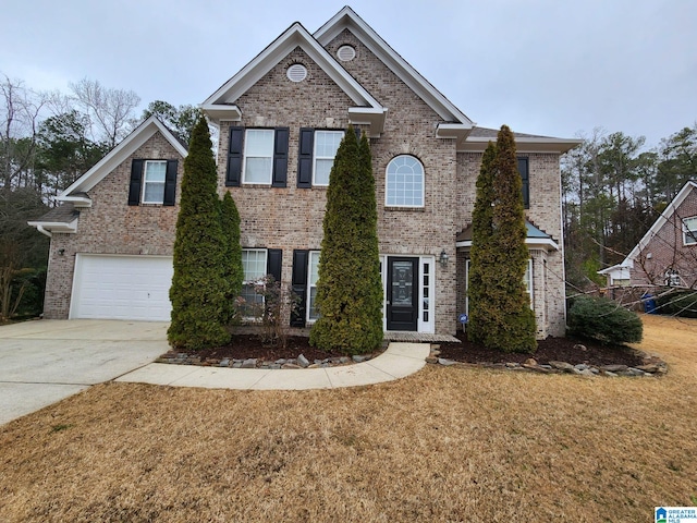 view of front of house with a garage and a front lawn