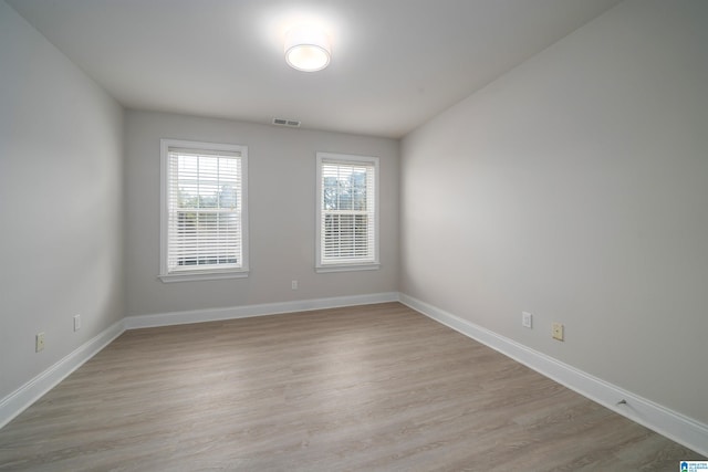 spare room featuring light hardwood / wood-style flooring