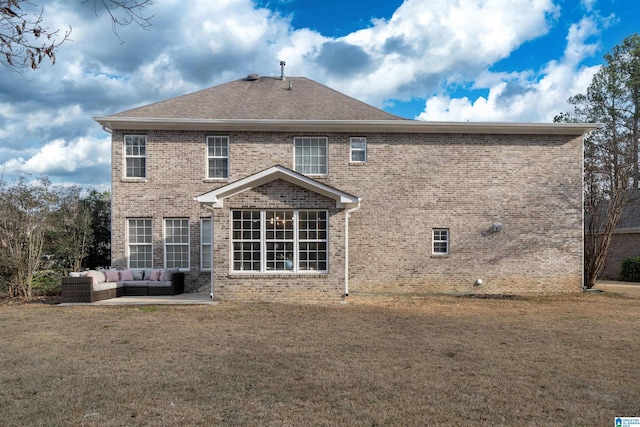 back of house with outdoor lounge area, a yard, and a patio area