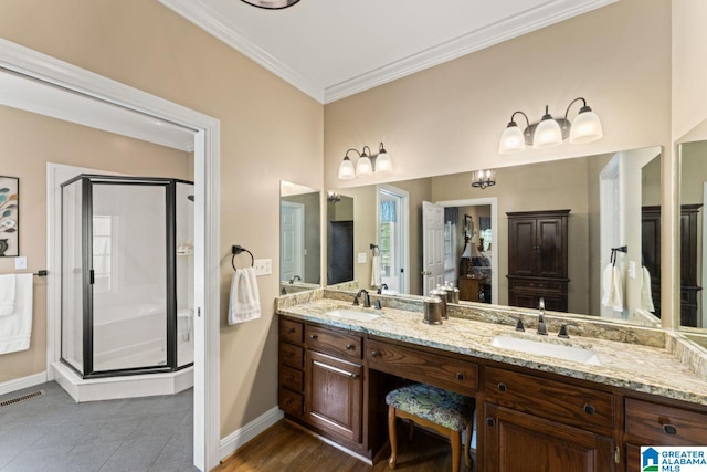 bathroom with ornamental molding, vanity, and walk in shower