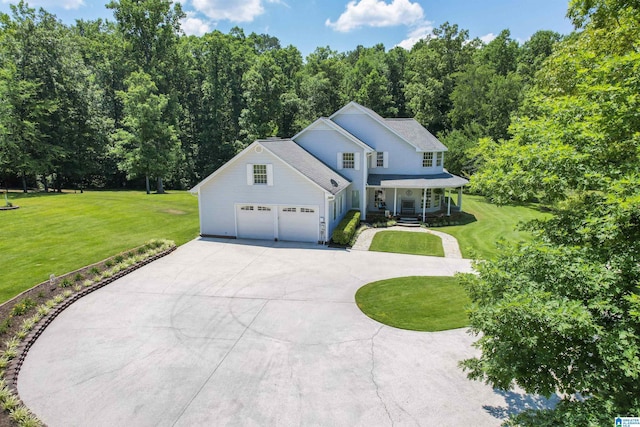 view of property featuring covered porch and a front lawn