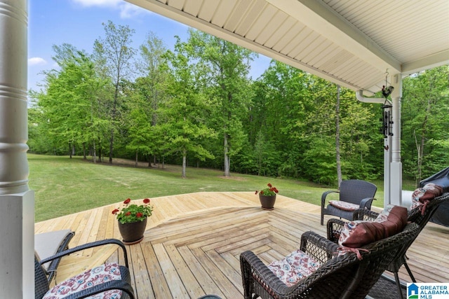 wooden deck with a lawn