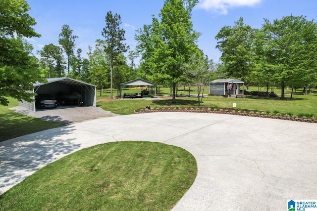 exterior space with a carport and a front lawn