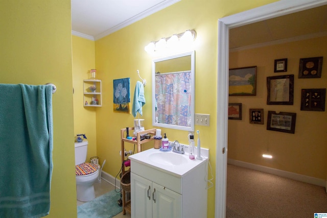 bathroom featuring vanity, crown molding, and toilet