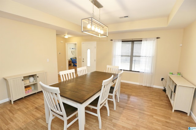 dining area with light hardwood / wood-style floors