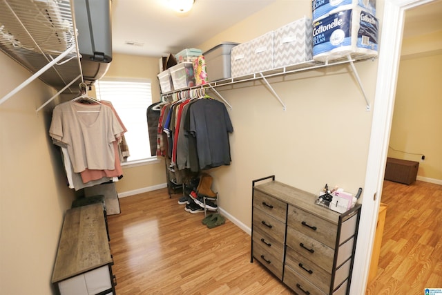 walk in closet featuring light hardwood / wood-style floors