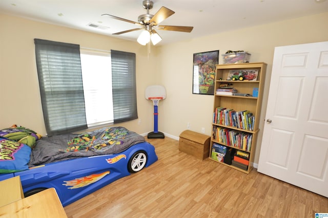 bedroom featuring hardwood / wood-style floors and ceiling fan