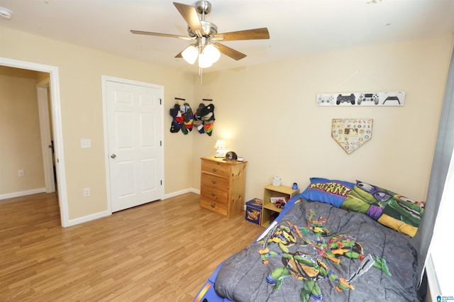 bedroom featuring hardwood / wood-style flooring and ceiling fan