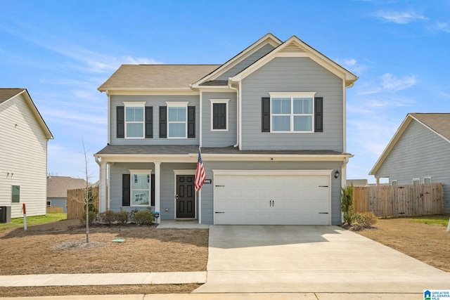 view of front of house with central AC and a garage