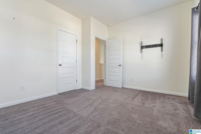 unfurnished bedroom with carpet floors